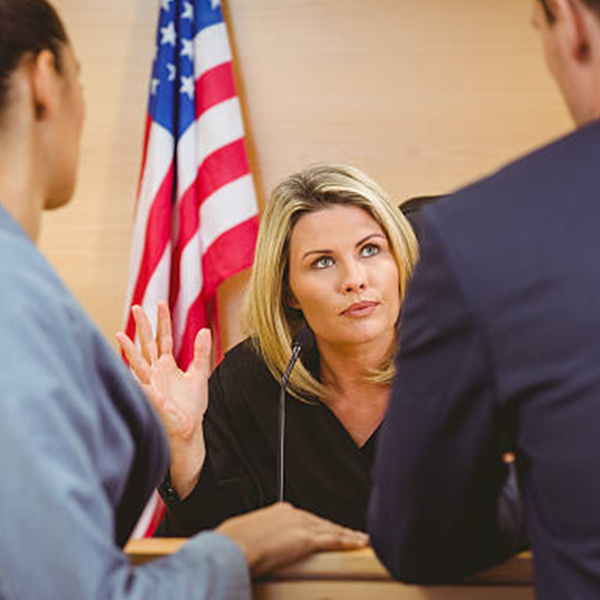 Judge speaks to attorneys at the bench
