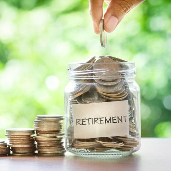 Photo of a jar full of coins, labeled retirement with a hand adding another coin. 