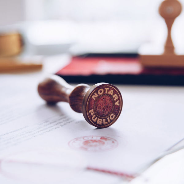 Image of a notary stamp laying on a document