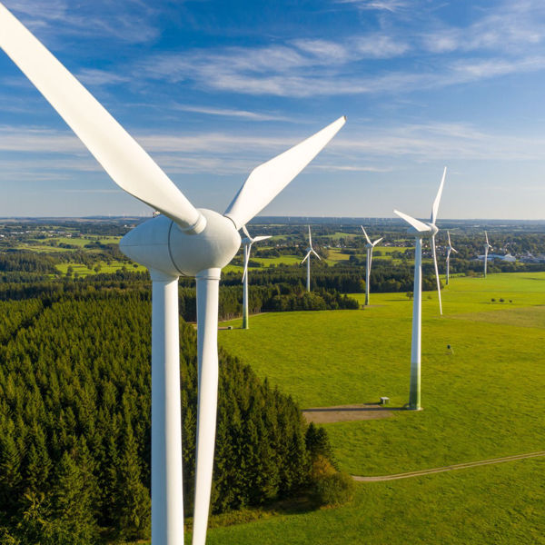 Wind turbines in operation over a field