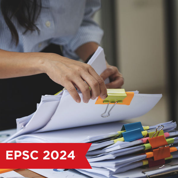 Woman sorting through a stack of documents