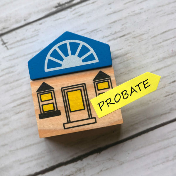 Small wooden house with tag attached reading Probate