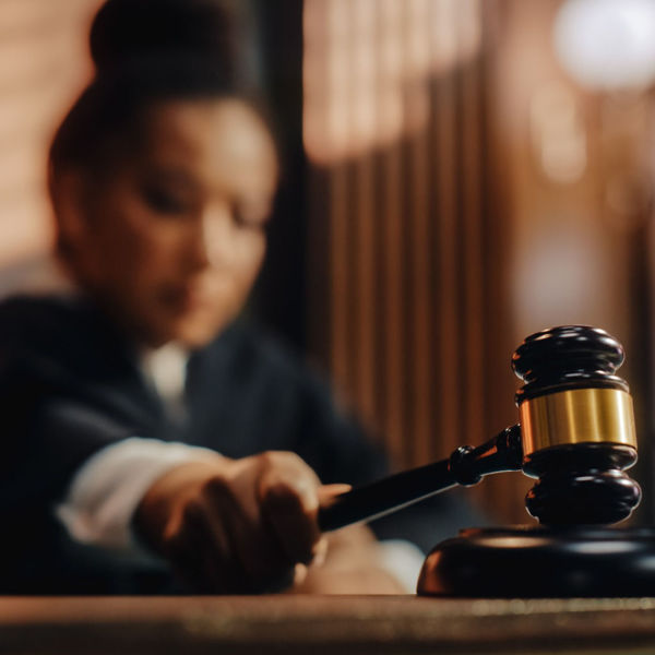 Female judge using gavel