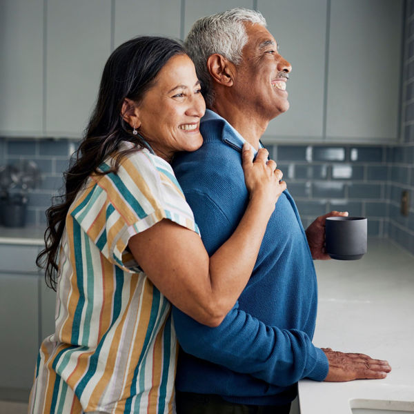 older couple embracing and happy
