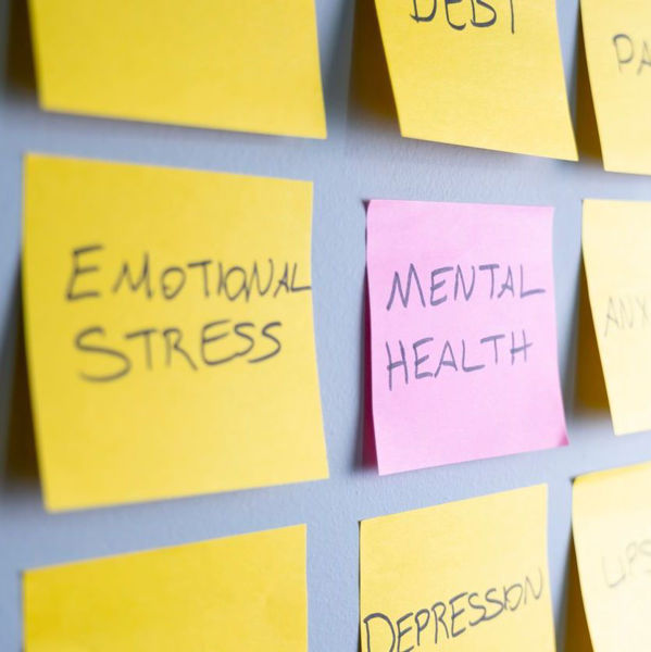 Post-It Notes on a board, reading Emotional Stress and Mental Health
